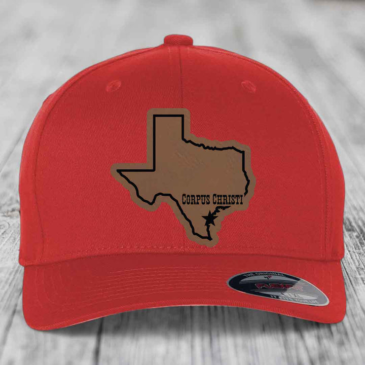 Black baseball cap with brown leather patch of Texas state outline and &