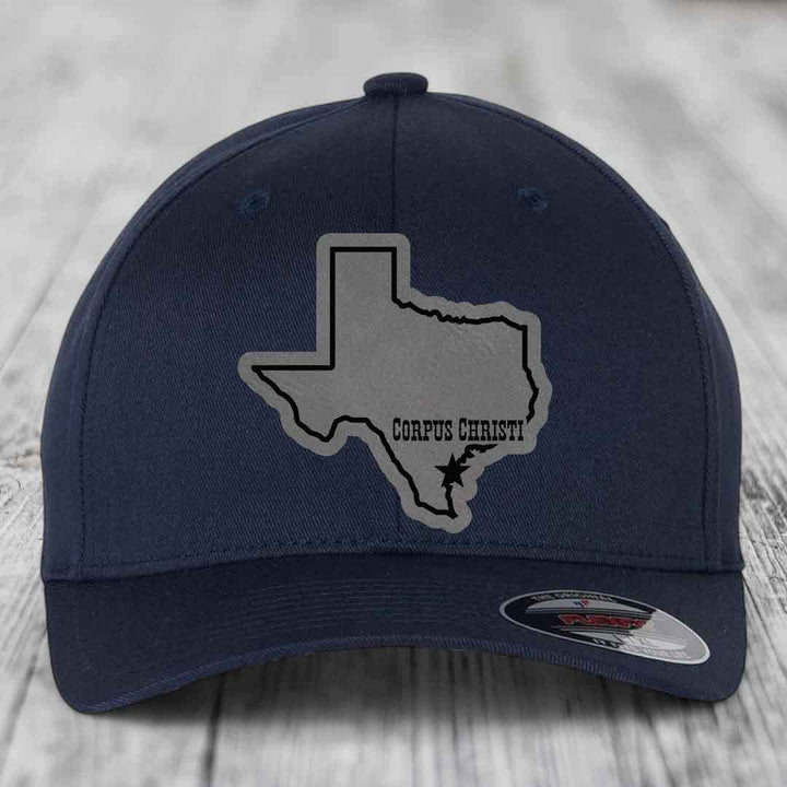 Dark blue baseball cap with gray Texas outline patch featuring &
