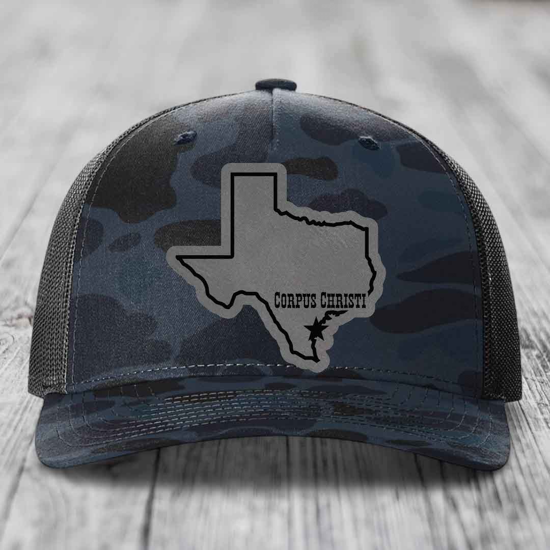 Camouflage trucker hat with gray Texas state patch and &
