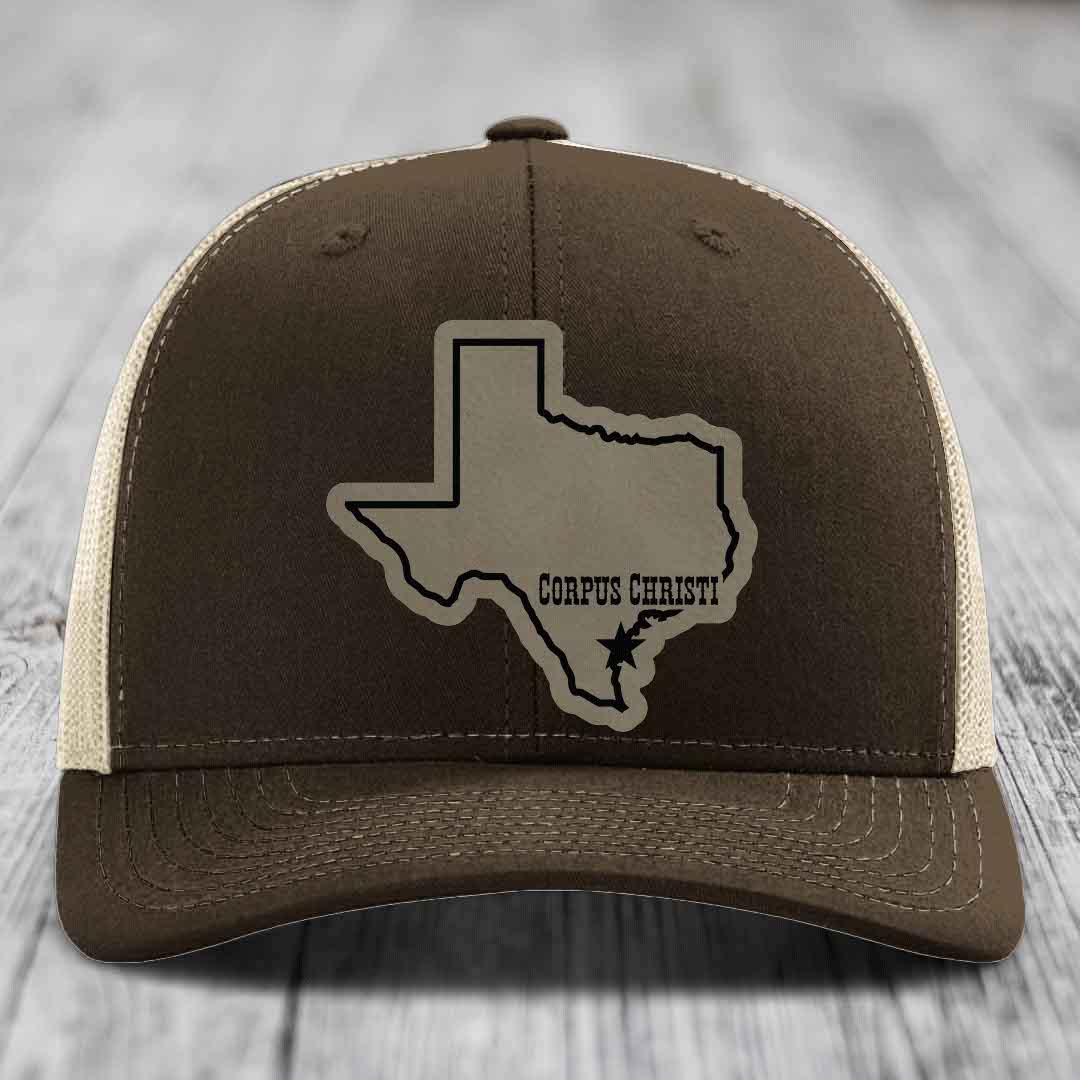 Green trucker hat with tan leather patch of Texas state outline and &