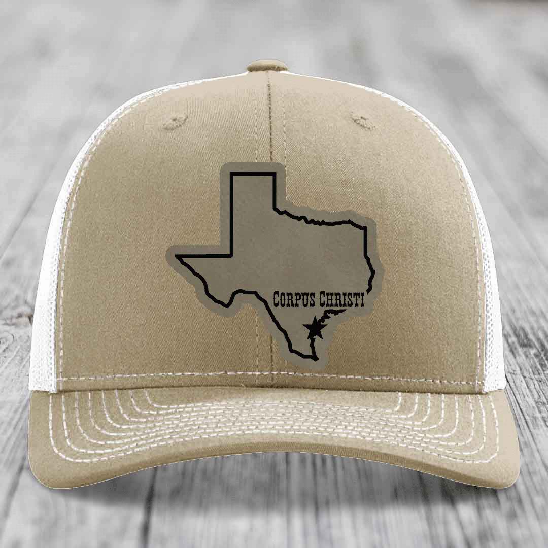 Olive green trucker hat with tan leather patch showing Texas outline and &