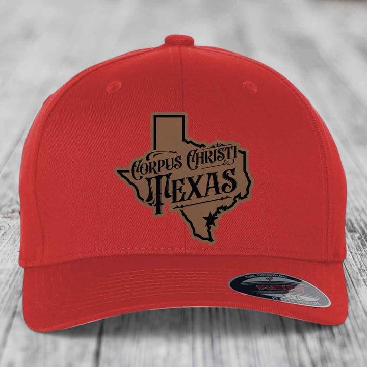 Black trucker hat with brown cross of nails patch on front.