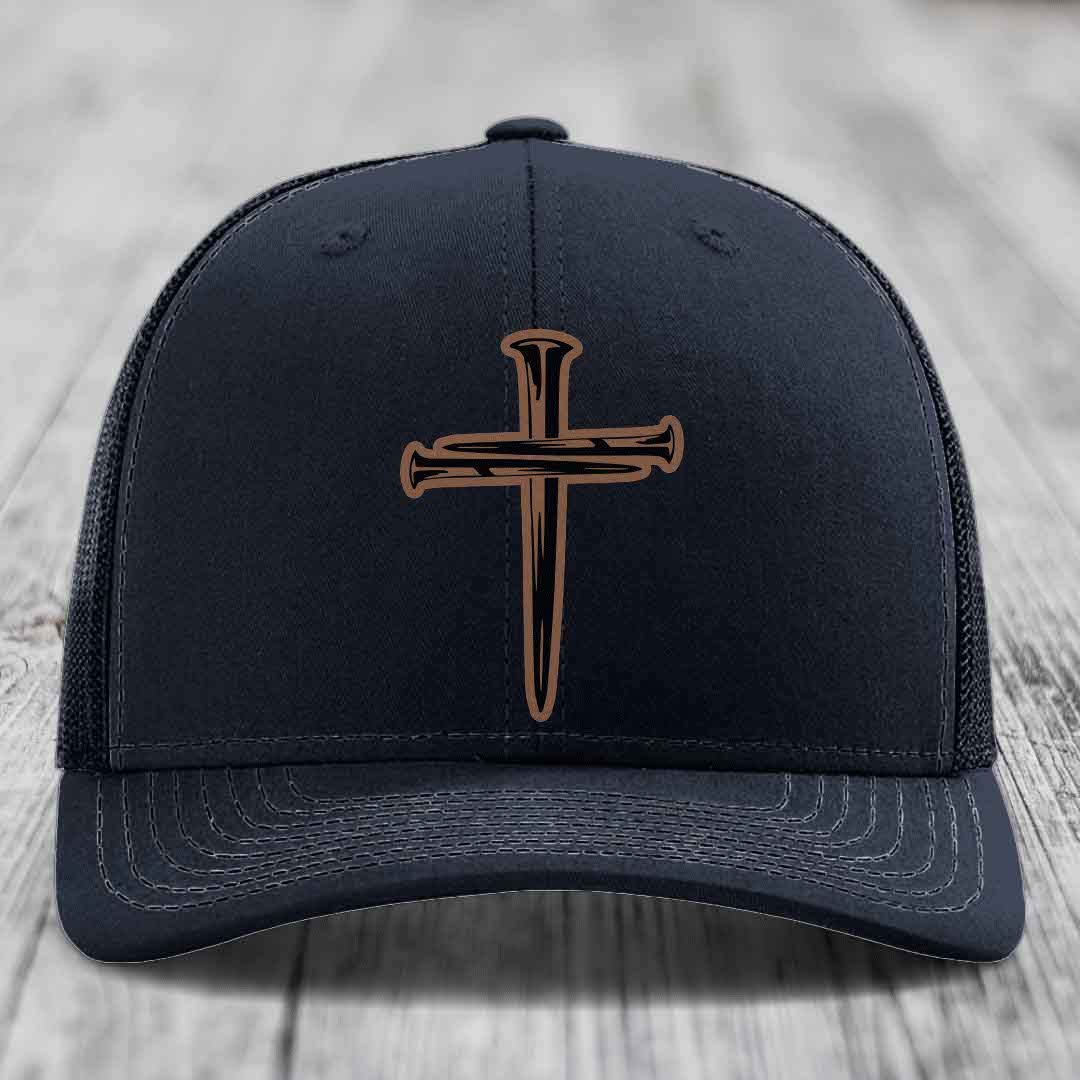 Purple baseball cap with a cross made of nails patch on front.