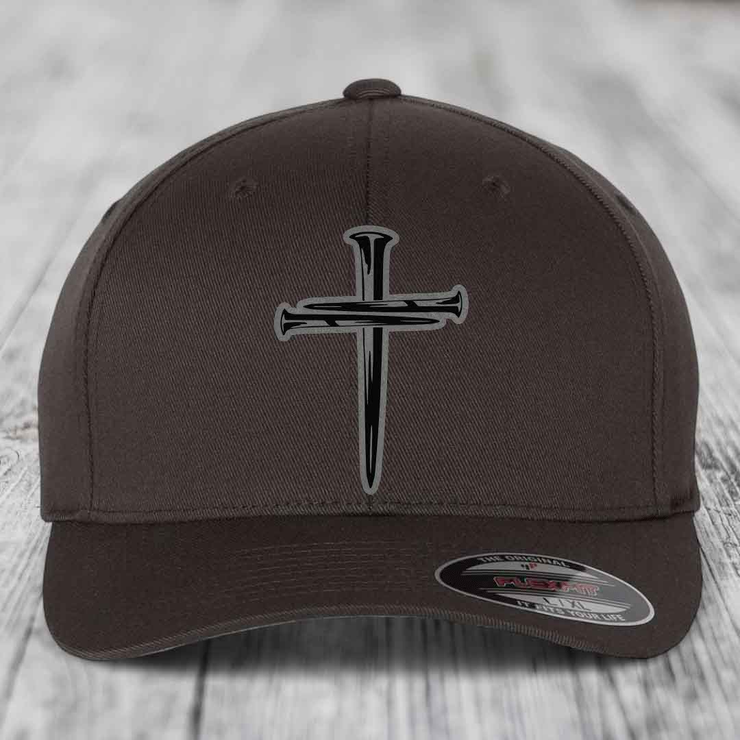 Dark brown Flexfit hat with a cross of nails patch on front.