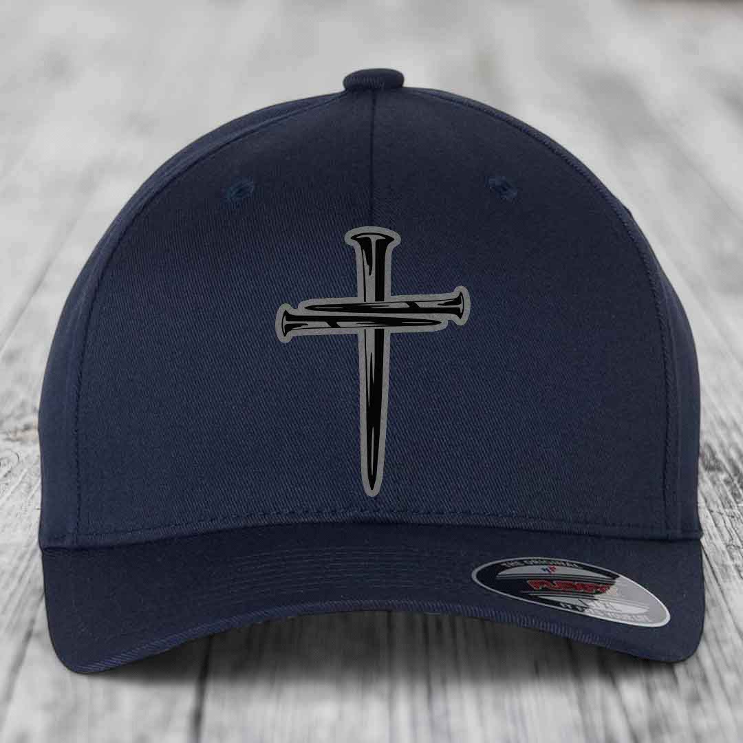 Dark blue baseball cap with a cross made of nails patch on front.