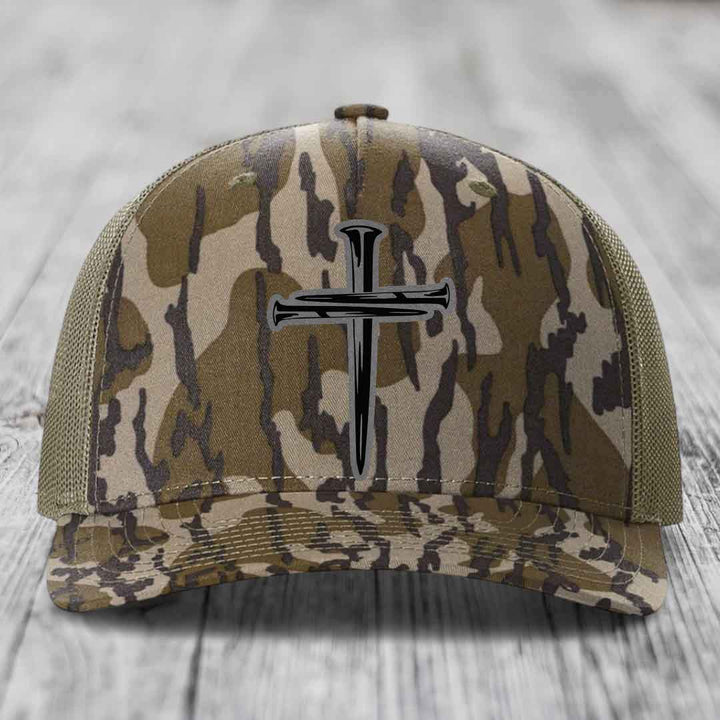 Blue and white trucker hat with a cross of nails patch on front.