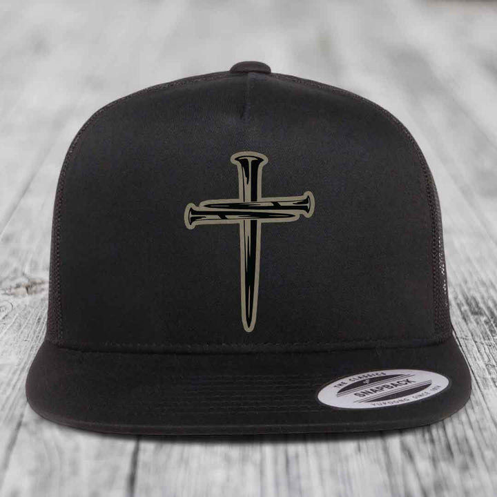 Black and white trucker hat with a cross made of nails patch on front.