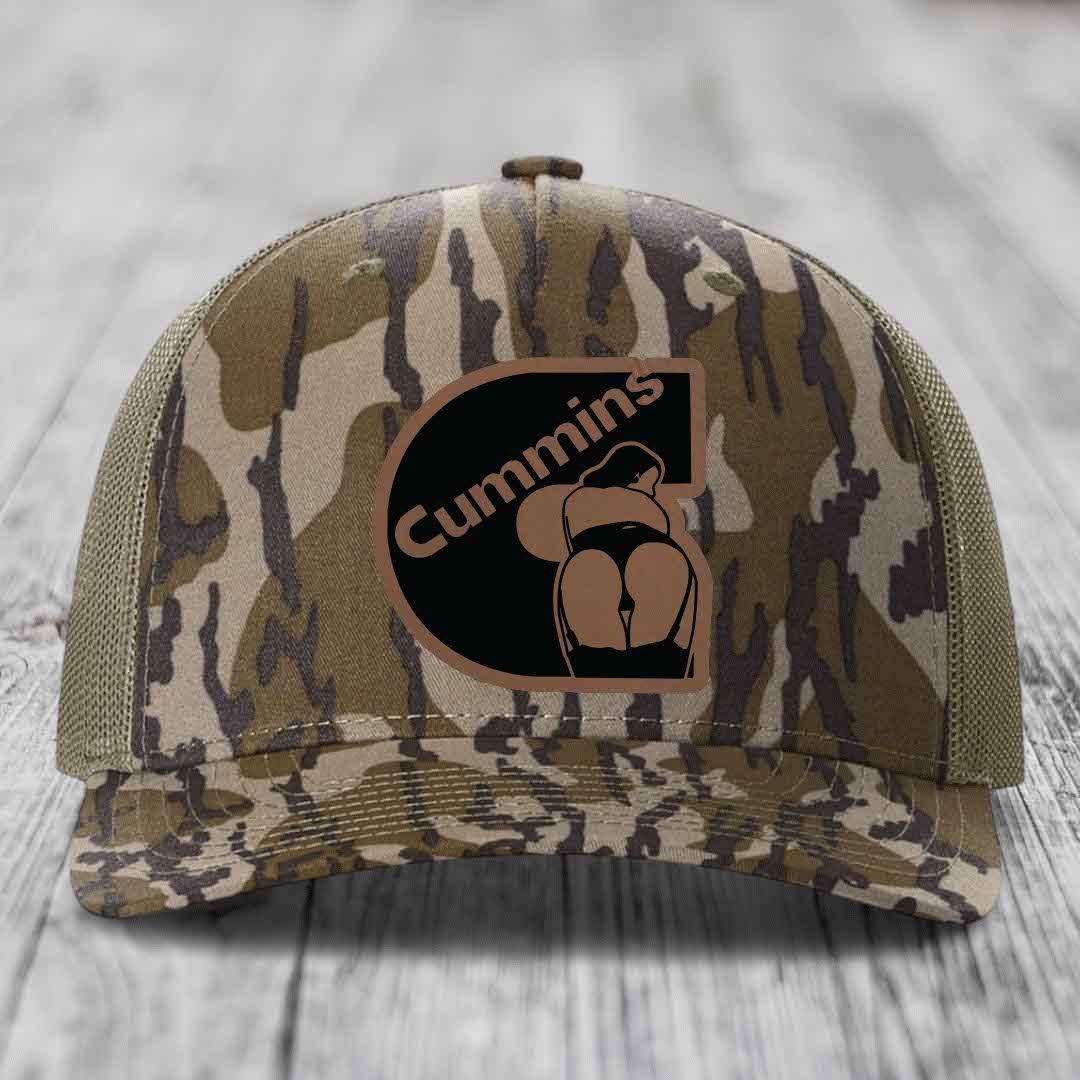 Blue and white trucker hat with a brown Cummins logo patch on the front.