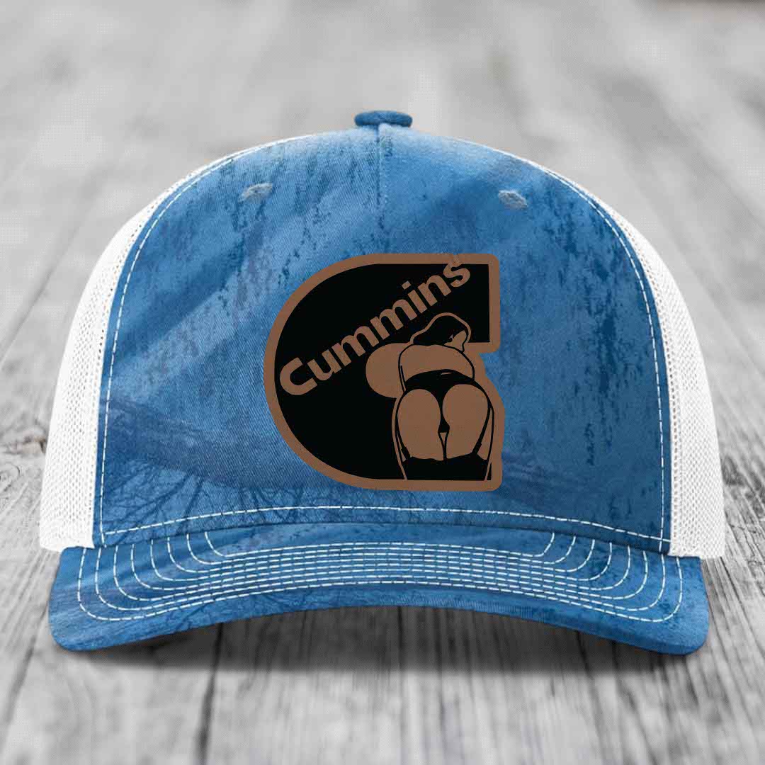 Camouflage trucker hat with brown leather patch featuring &
