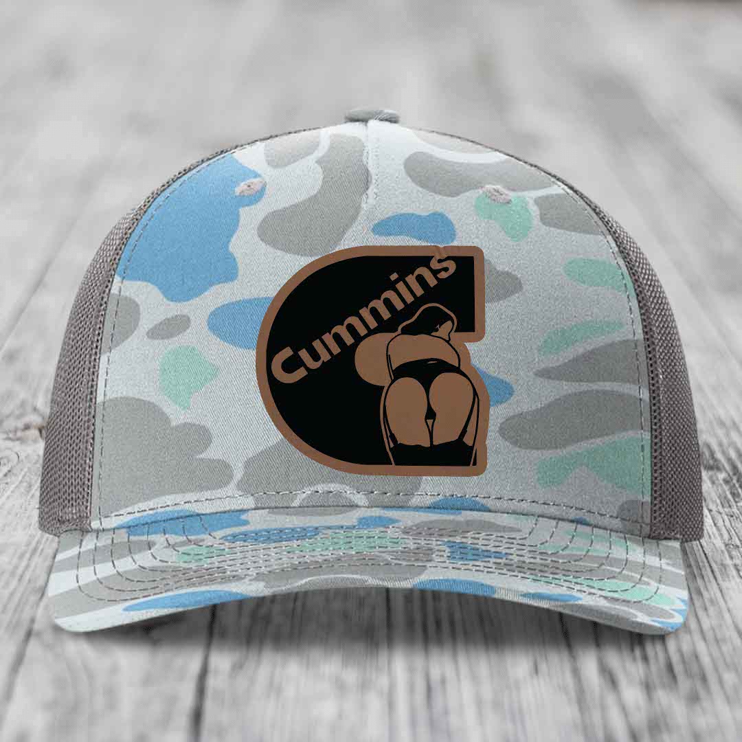 Black snapback trucker hat with brown leather patch featuring &
