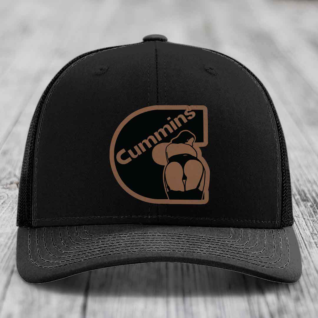 Tan and blue trucker hat with Cummins logo patch on front.