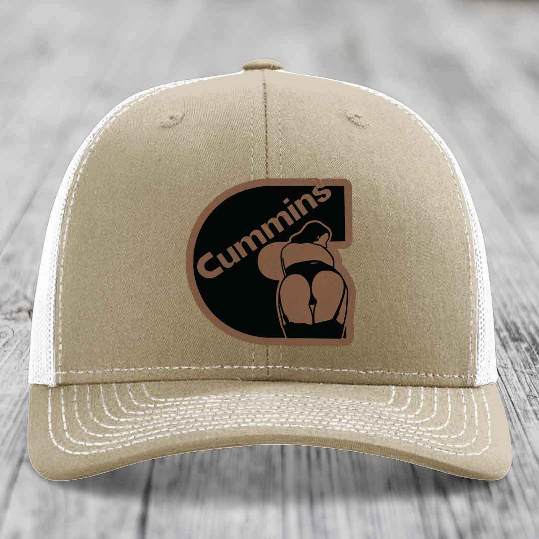 Olive green trucker hat with Cummins logo patch featuring a stylized &