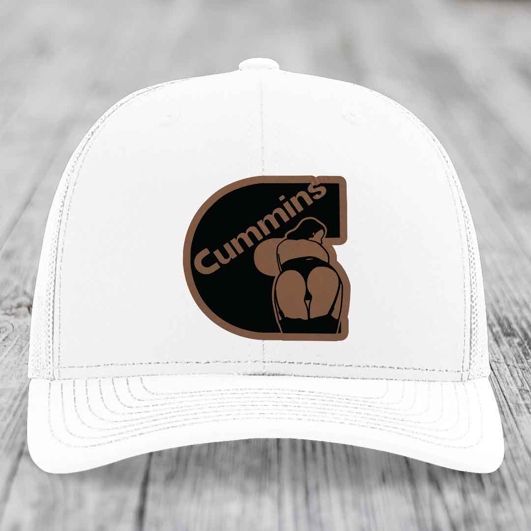Camouflage trucker hat with brown leather patch featuring &