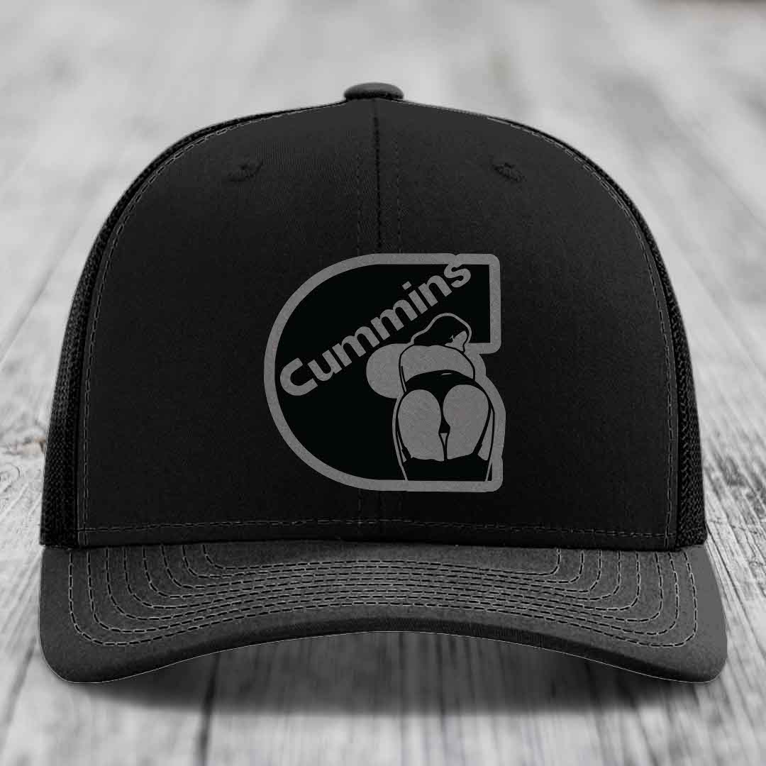 Tan and blue trucker hat with Cummins logo patch on front.