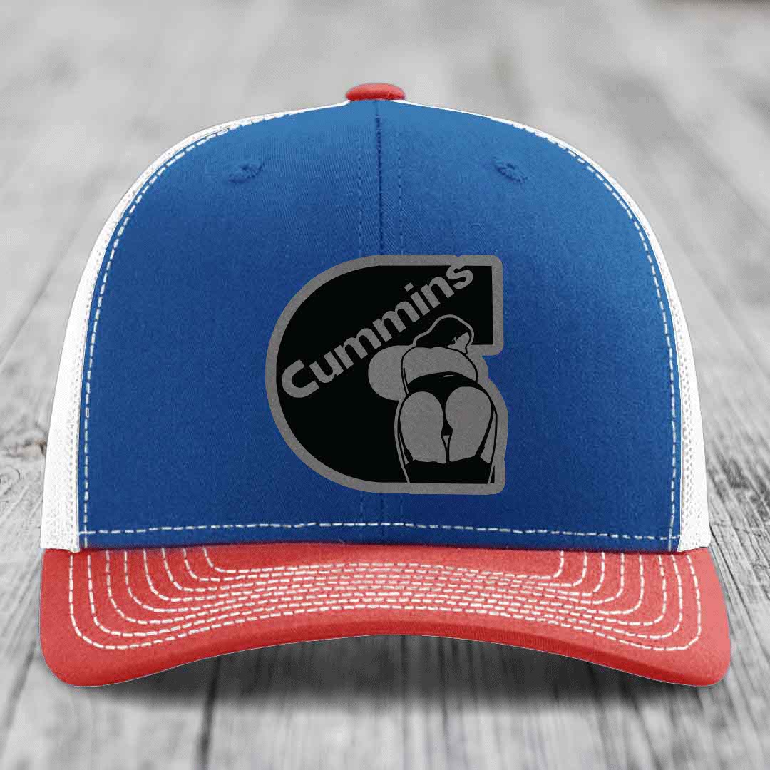 White trucker hat with black Cummins logo patch featuring a stylized engine design.