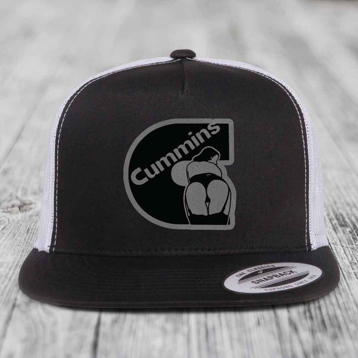 Grey trucker hat with black Cummins logo patch featuring a stylized figure.