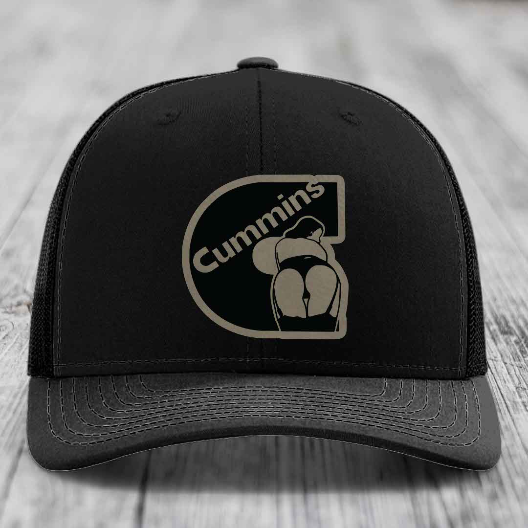 Tan and blue trucker hat with black Cummins logo patch on front.