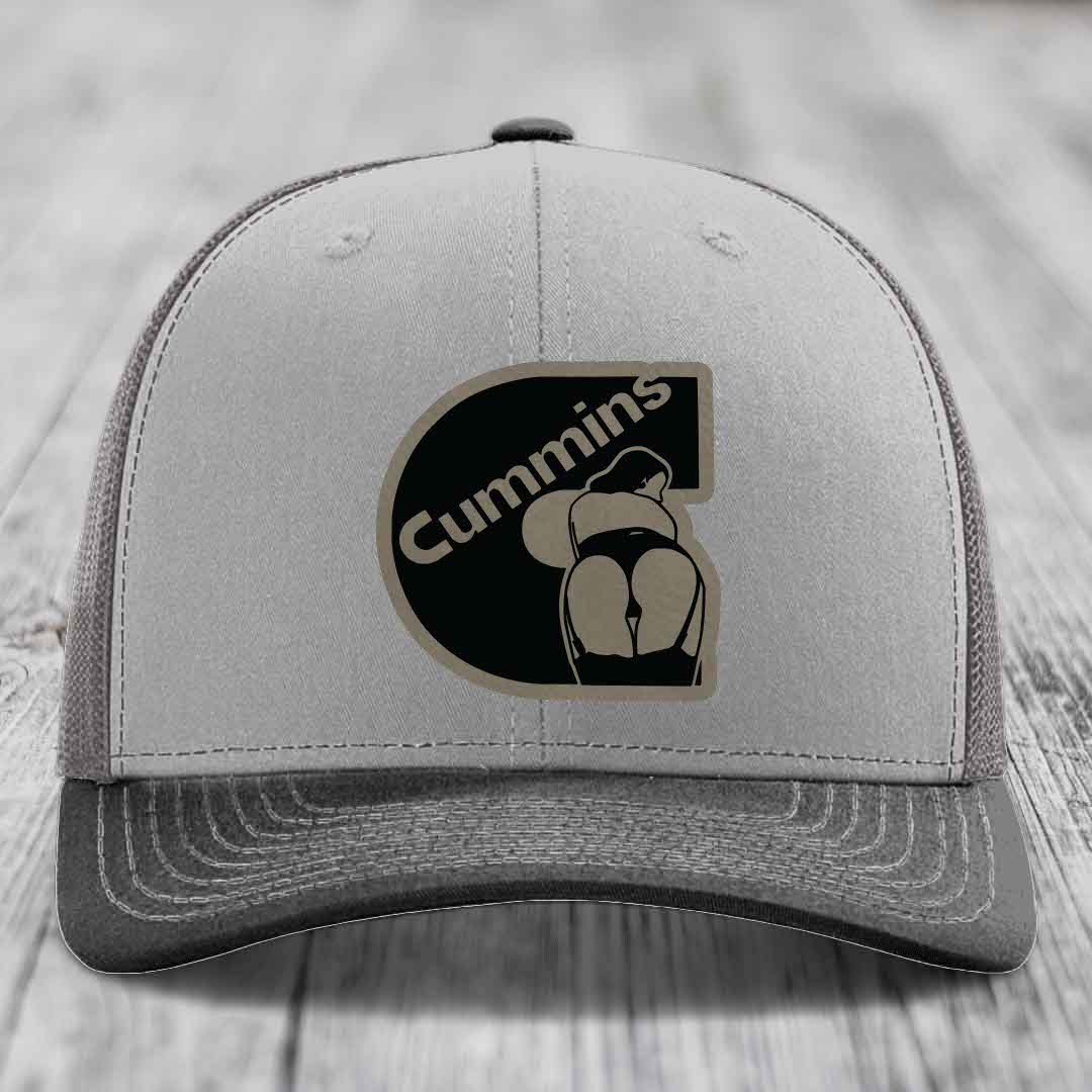 Grey and beige trucker hat with Cummins logo patch on front.