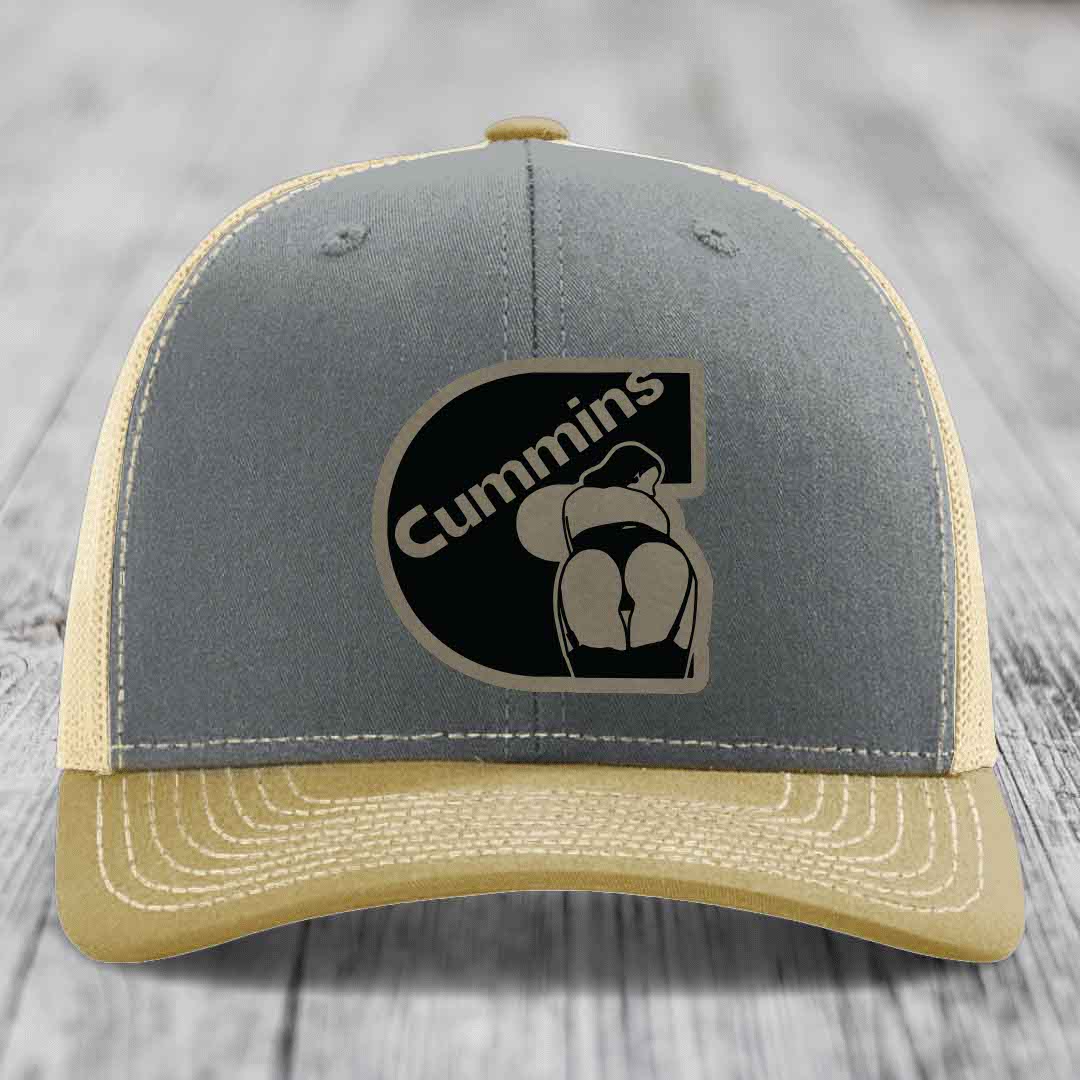 Grey trucker hat with black Cummins logo patch featuring a stylized engine design.