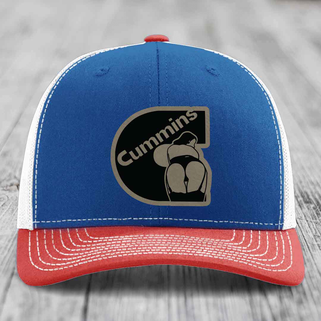 White trucker hat with black Cummins logo patch featuring a stylized engine design.