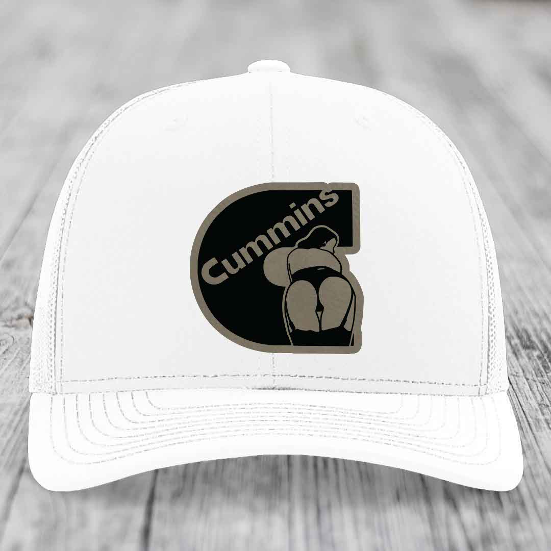 Black trucker hat with brown Cummins logo patch featuring a stylized figure.