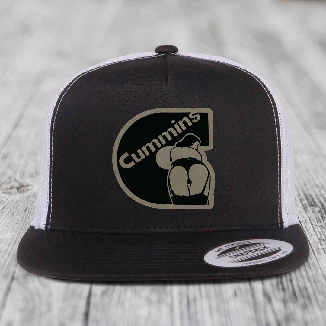 Grey trucker hat with black and beige Cummins logo patch on front.