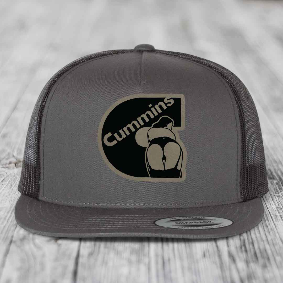 Grey trucker hat with black and tan Cummins logo patch on front.