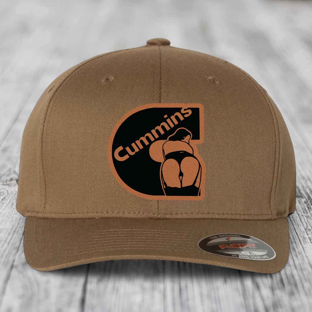Dark brown Flexfit hat with Cummins logo patch featuring a stylized &