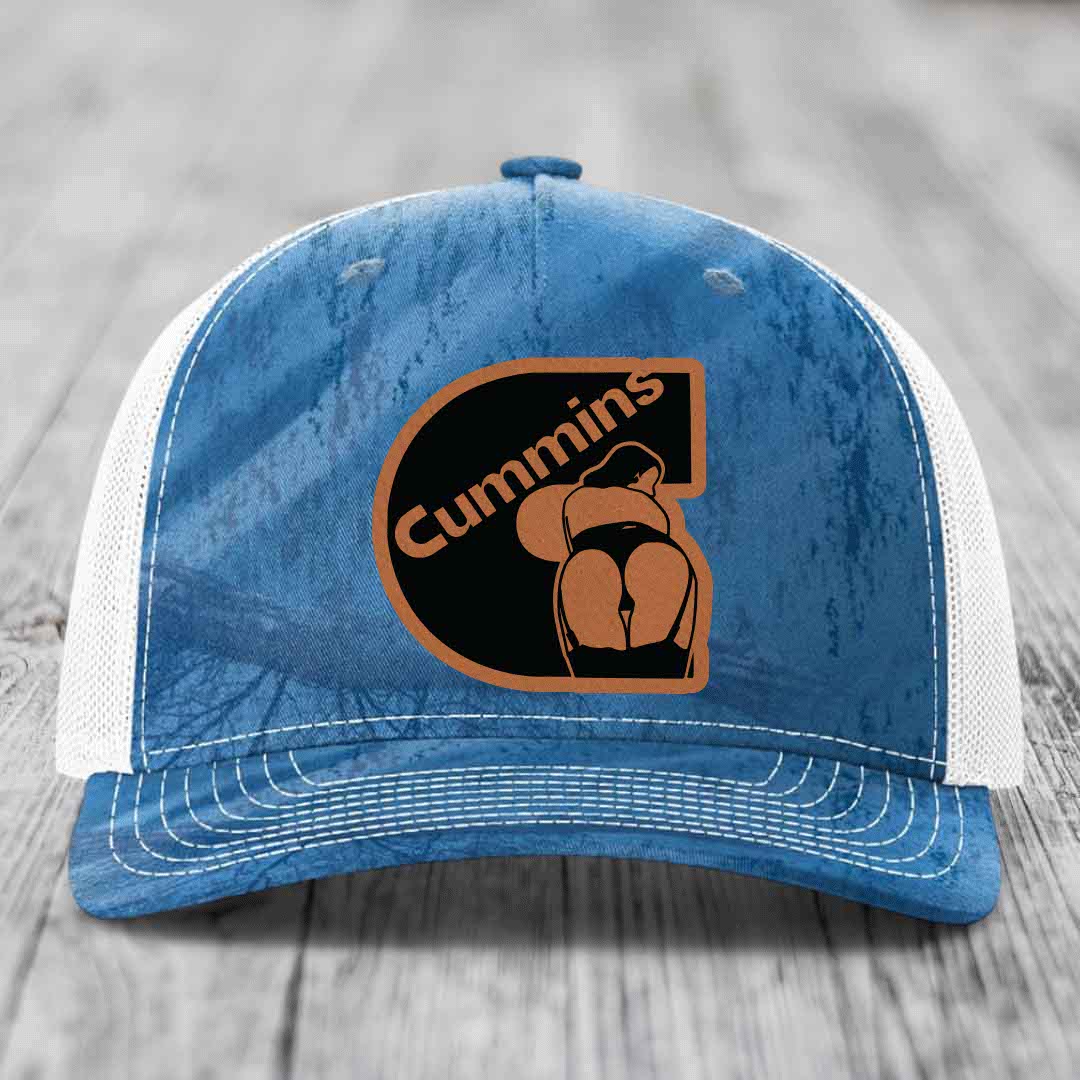 Camouflage trucker hat with brown leather patch featuring &