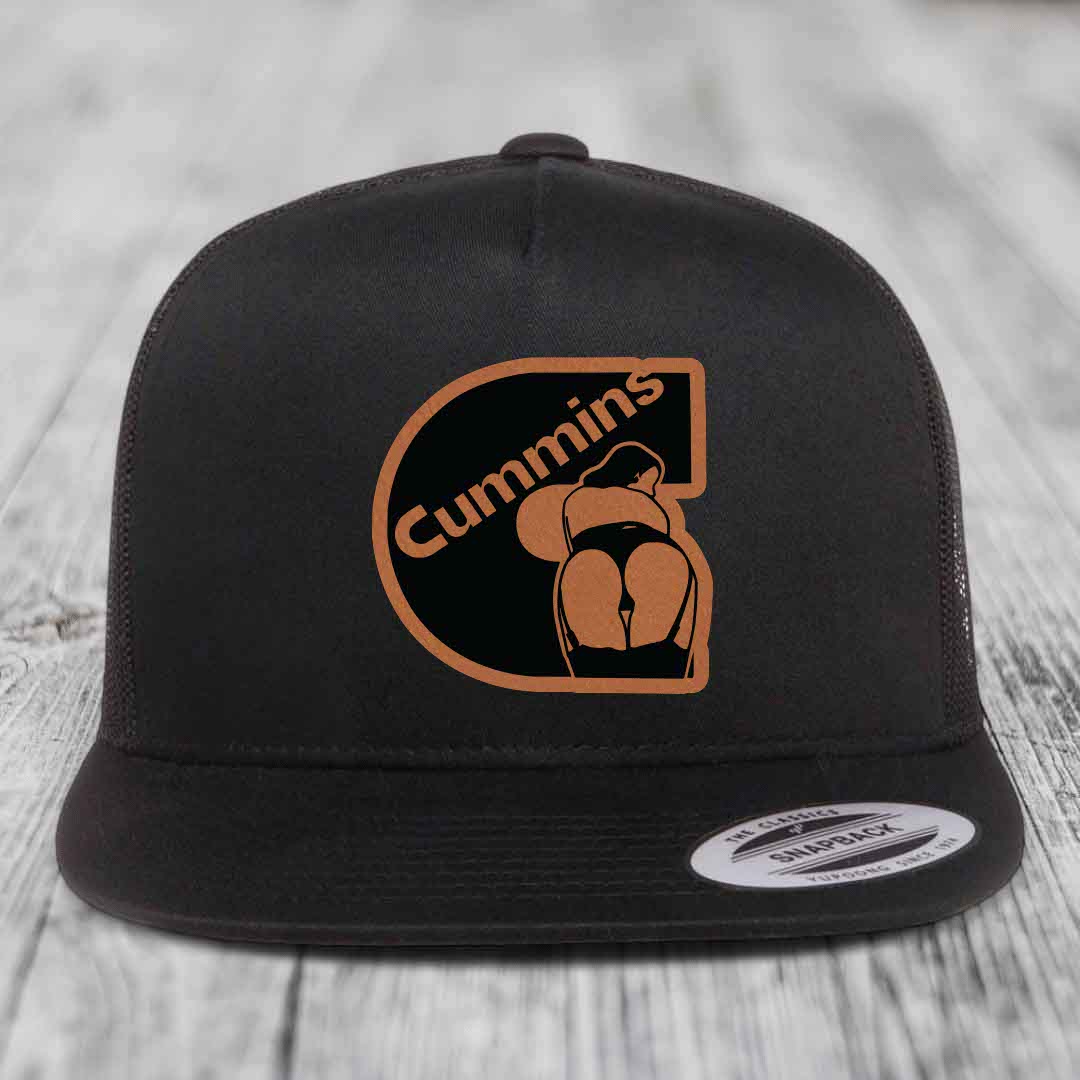 Black and white trucker hat with brown leather patch featuring &