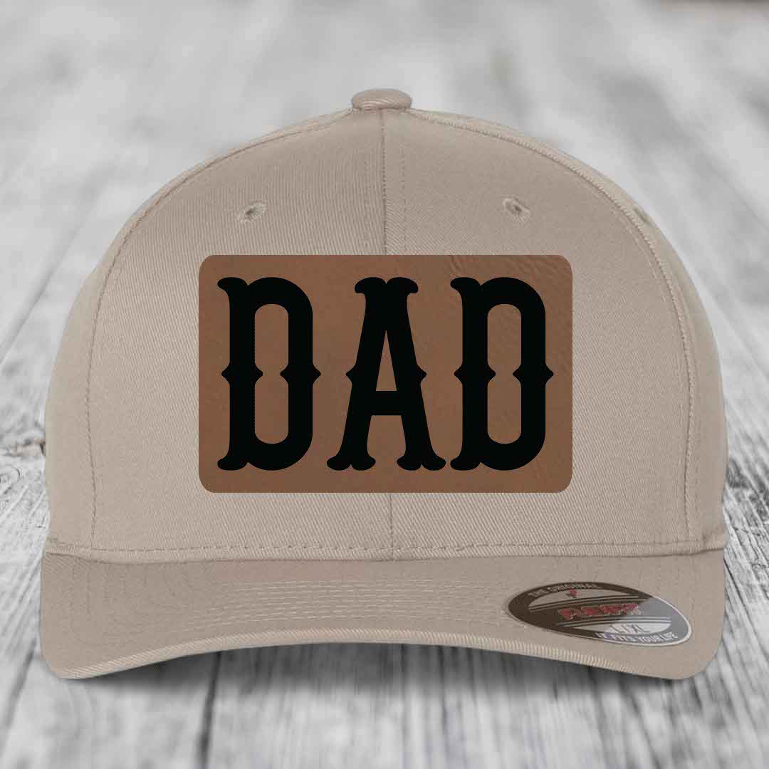 Dark blue baseball cap with a brown leatherette patch that reads &