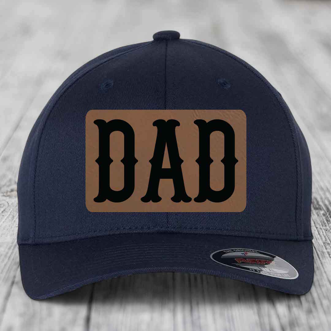 Red baseball cap with a brown leatherette patch that says &