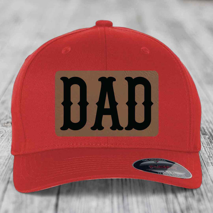 Black trucker hat with brown leatherette patch reading &