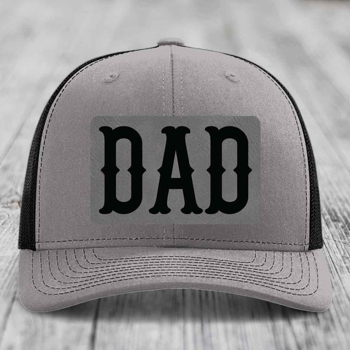 Grey trucker hat with blue mesh sides and black &