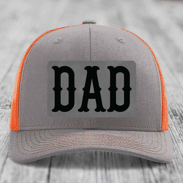 Grey trucker hat with pink mesh sides and black &