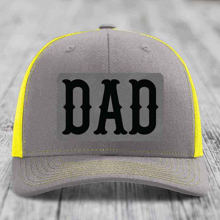 Brown trucker hat with beige mesh back and black &