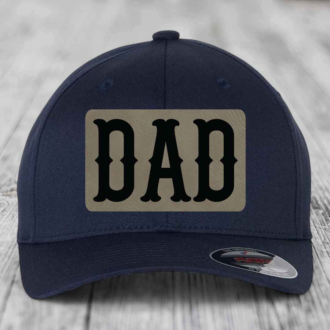 Dark blue baseball cap with a beige leatherette patch featuring the word &