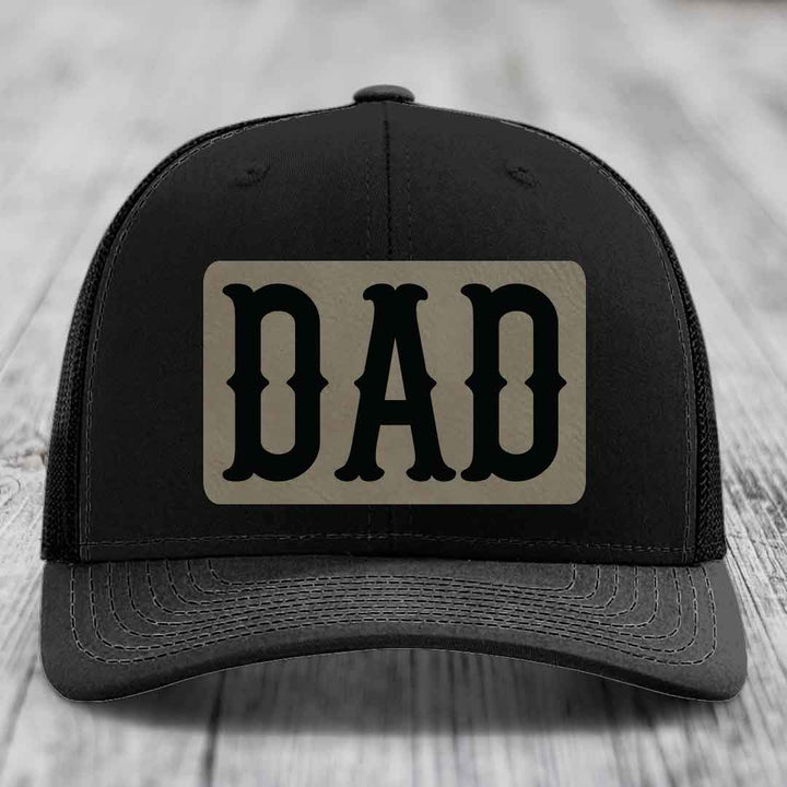 Tan and blue trucker hat with black &