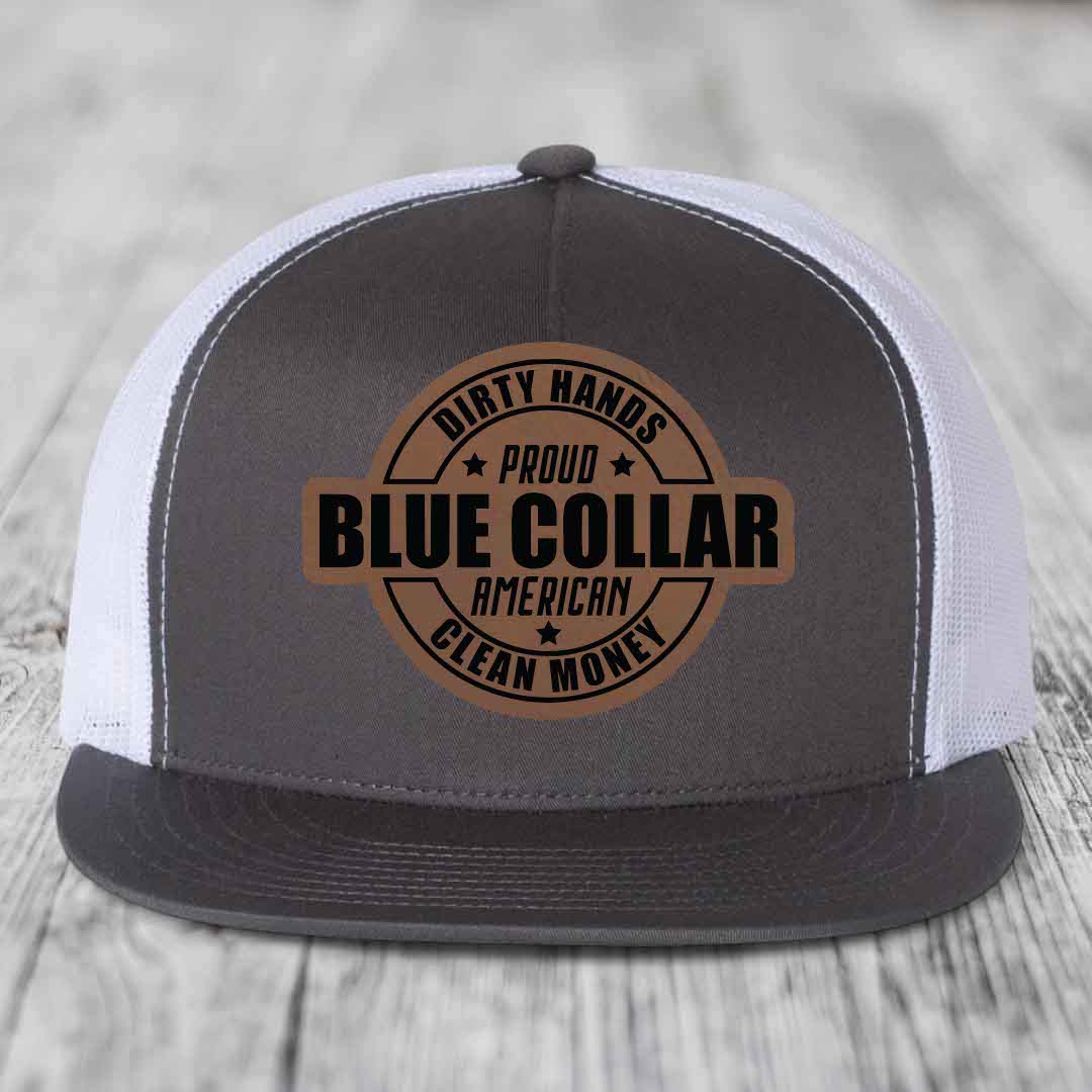 Red baseball cap with circular leather patch reading &