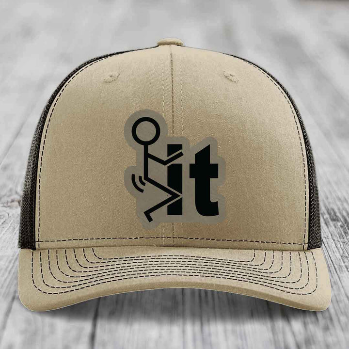 Beige trucker hat with black mesh back and a black &