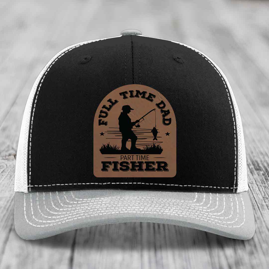 Black and white trucker hat with brown leather patch reading &