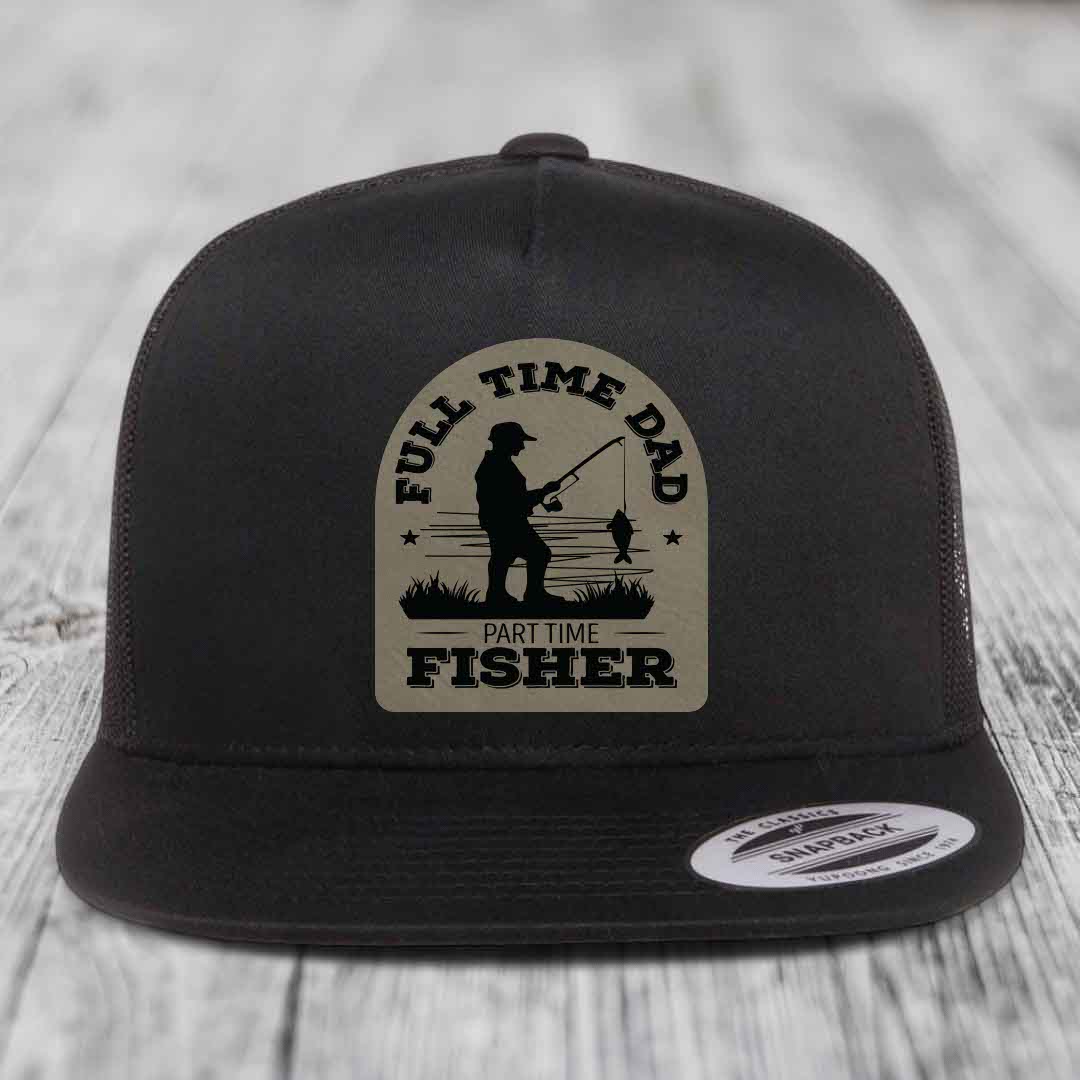 Black snapback trucker hat with beige patch showing fisherman silhouette and text &
