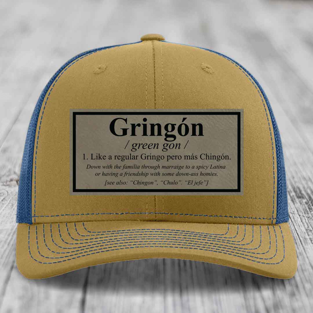 Tan and blue trucker hat with a &