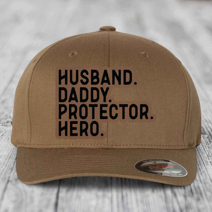 Husband Daddy Protector Hero - Leather Patch Hat - Dark Brown to Black Patch - Flexfit 6277 Fitted Hat