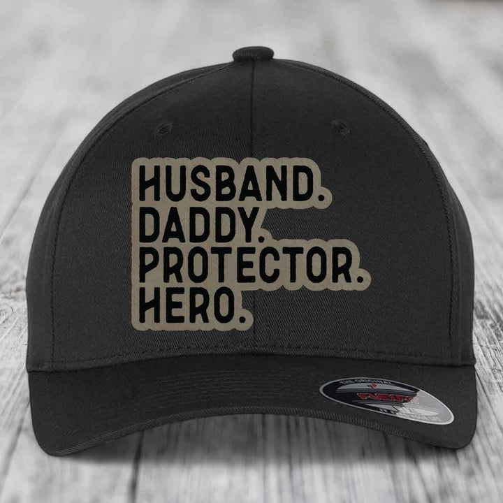 Husband Daddy Protector Hero - Leather Patch Hat - Light Brown to Black Patch - Flexfit 6277 Fitted Hat