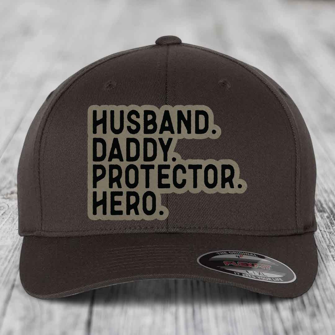 Husband Daddy Protector Hero - Leather Patch Hat - Light Brown to Black Patch - Flexfit 6277 Fitted Hat