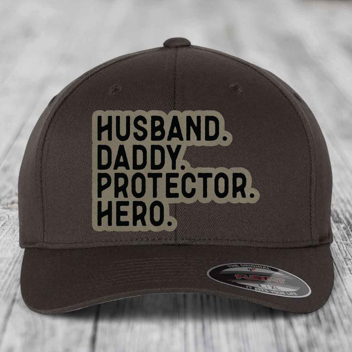 Husband Daddy Protector Hero - Leather Patch Hat - Light Brown to Black Patch - Flexfit 6277 Fitted Hat