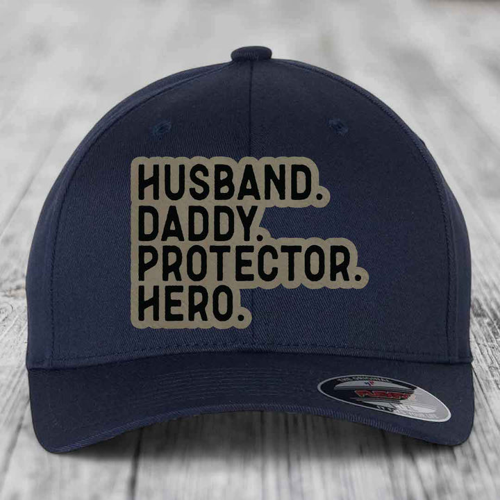Husband Daddy Protector Hero - Leather Patch Hat - Light Brown to Black Patch - Flexfit 6277 Fitted Hat
