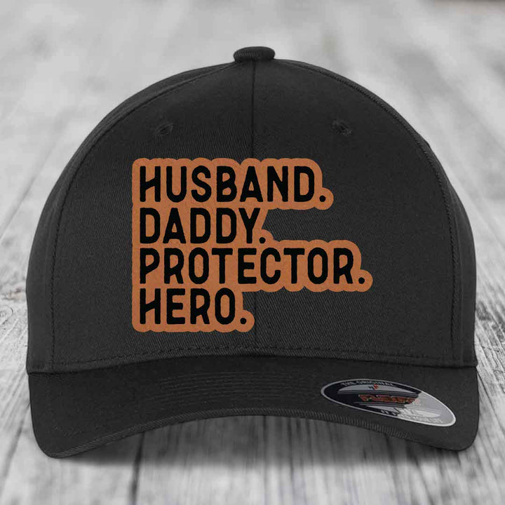 Husband Daddy Protector Hero - Leather Patch Hat - Rawhide to Black Patch - Flexfit 6277 Fitted Hat