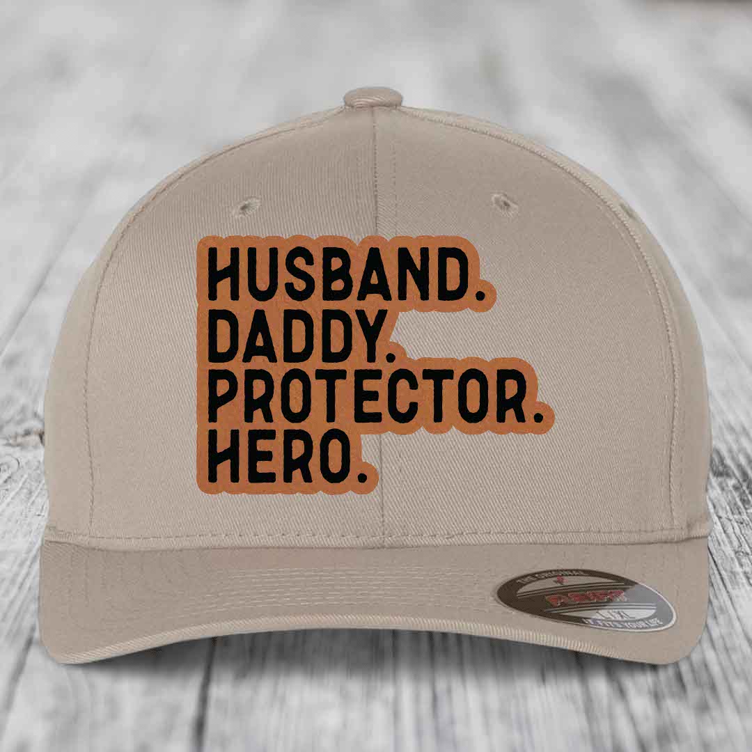 Husband Daddy Protector Hero - Leather Patch Hat - Rawhide to Black Patch - Flexfit 6277 Fitted Hat